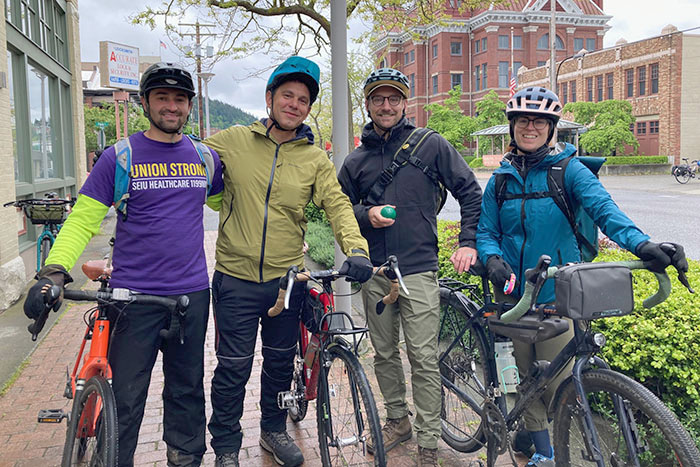 Group of bike riders posing for picture